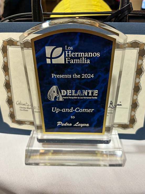 Glass Trophy that reads, Los Hermanos Familia presents the 2024 Adelante (Awards Recognition by Los Hermanos Familia) Up-and-Comer to Pedro Leyva