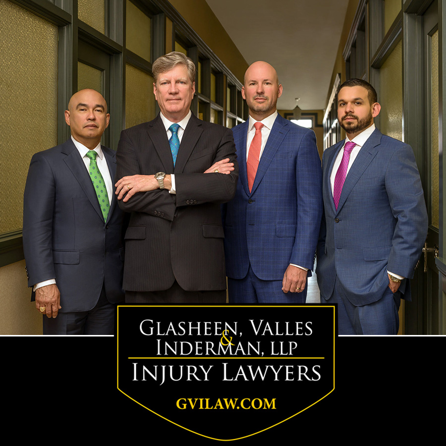 Image of 4 Senior Partners at Glasheen, Valles & Inderman Injury Lawyers. From Left to Right: Senior Partner and Attorney, Noe Valles, Senior Partner and Attorney, Kevin Glasheen, Senior Partner and Attorney, Chad Inderman, and Senior Partner and Attorney, Pedro Leyva. Glasheen, Valles, and Inderman Injury Lawyer Black and Yellow Shield Logo, followed by GVILAW.COM.