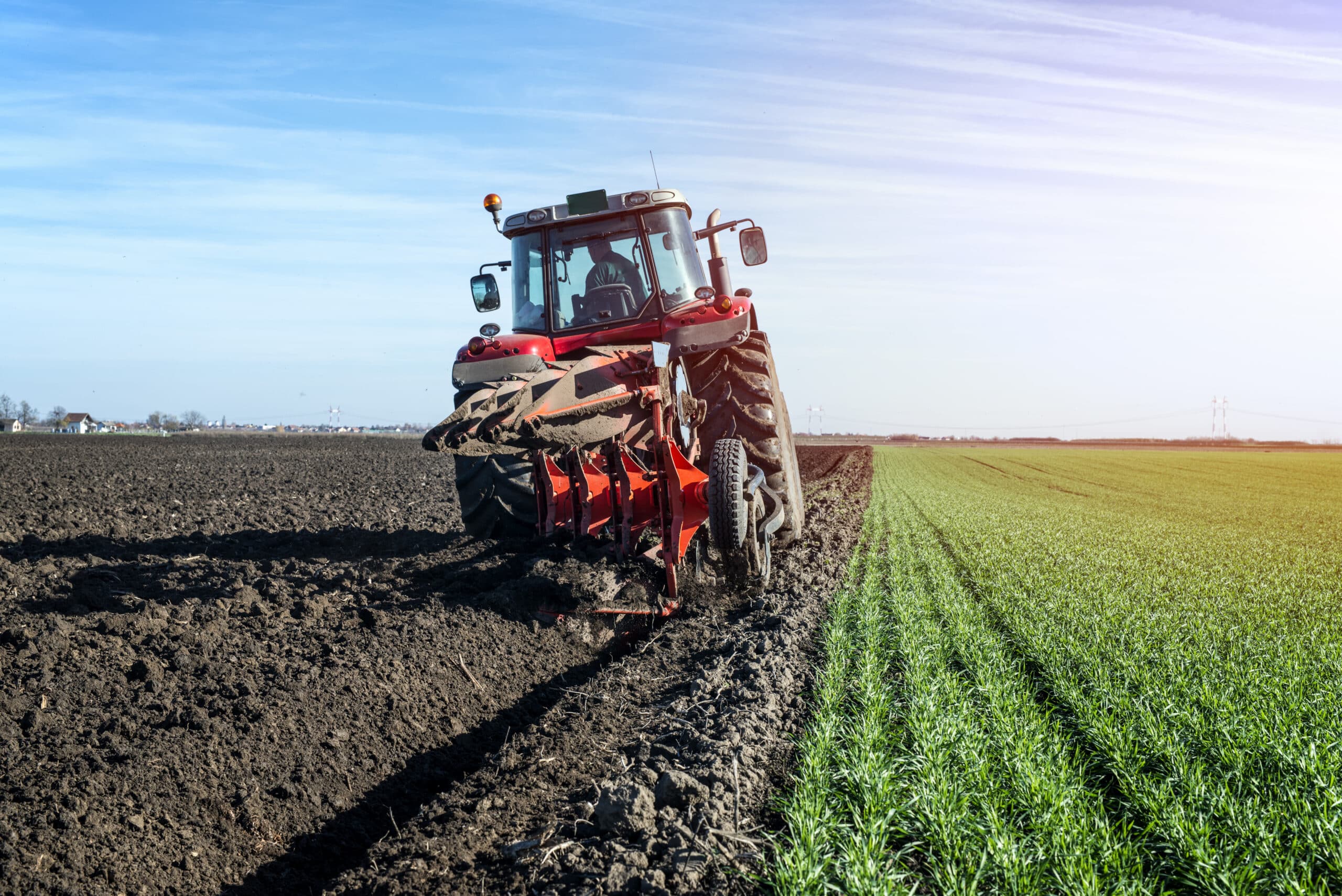 Picture showing a tractor cultivating a field to show an example of where a farming accident injury might occur